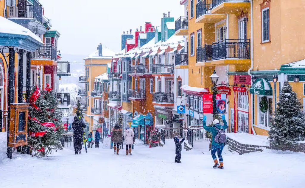 Snowy Mont Tremblant pedestrian village with colorful buildings
